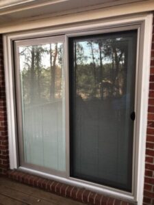 Sliding Glass Doors - A newly installed sliding glass door with a durable frame enhances this home's exterior, providing smooth functionality and a clear outdoor view.