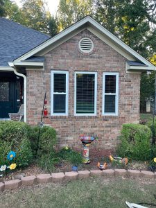 Window Replacement Service - A newly installed set of windows enhances this brick home’s energy efficiency, curb appeal, and natural light.