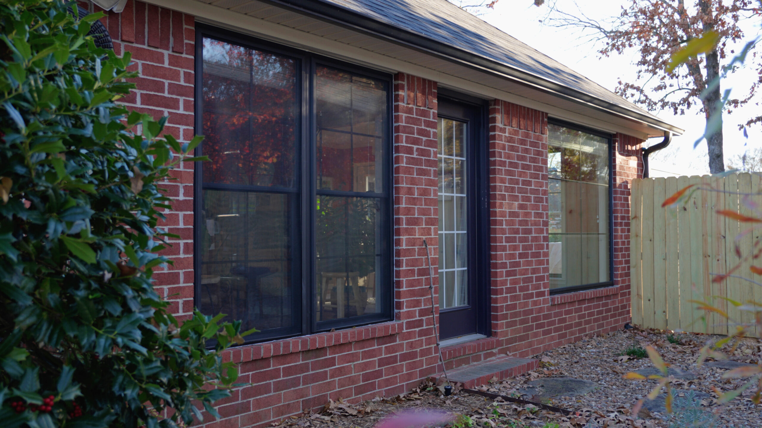 Professional Window Replacement - A newly installed window enhances this brick home’s energy efficiency, style, and natural light.